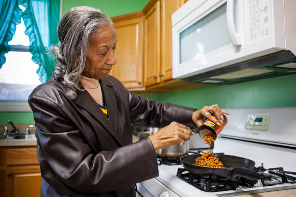 McCullum making dinner in her restored kitchen