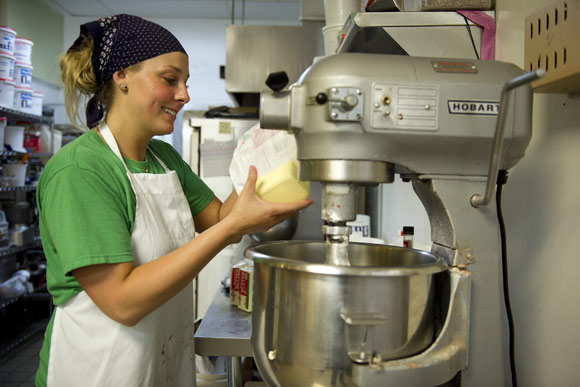 Alexandra Cheppa bakes cupcakes for Curbside Cupcakes at Union Kitchen, a food incubator. Curbside Cupcakes, a food truck and retail stand at Union Market, is an example of how new trends are shaping D.C.'s food economy