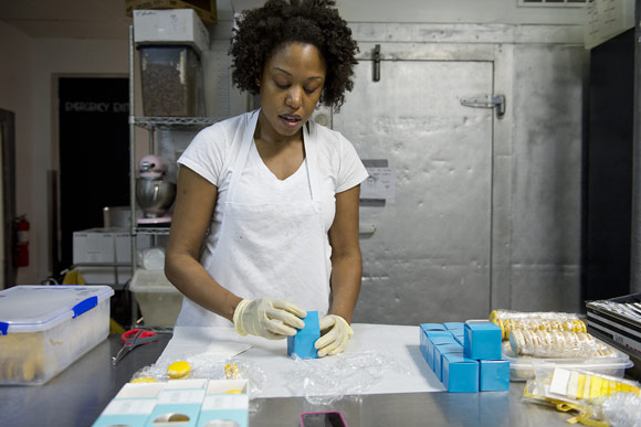 Alexandrine Debianchi, owner of D.C. Patisserie, boxes macarons at Union Kitchen