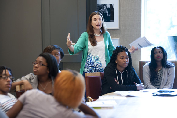 Project coordinator Tyran Omary leads students from Dunbar High School