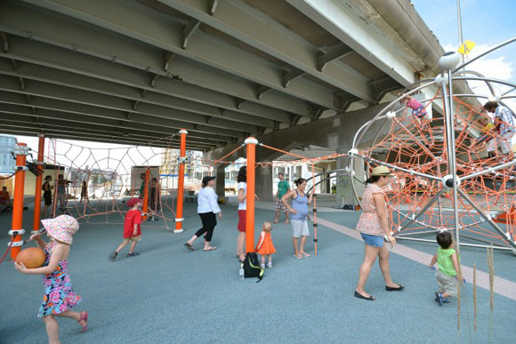 Toronto Underpass Park, built by Waterfront Toronto in the derelict space beneath a freeway, offers a playground, skatepark and more