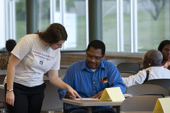 Morgan Golin, a retention specialist with Goodwill, looks over an application for a training candidate