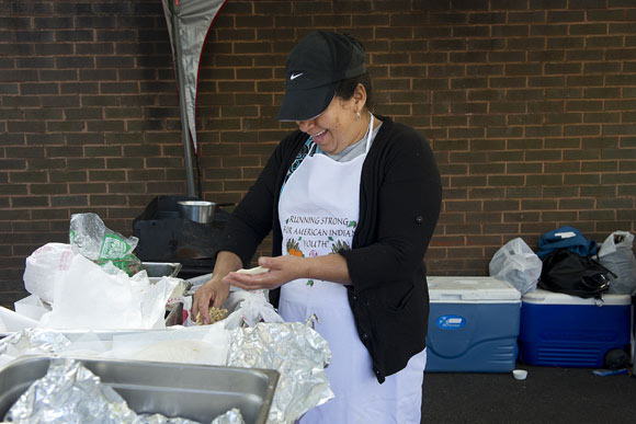 Candy Del Sid makes pupusas at the Crossroads Community Market