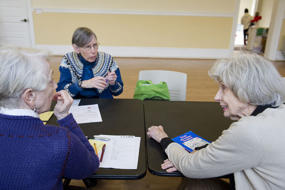 Lynn Schrite, Marsha Goldberg and Mary Elizabeth Pate practice French during "Conversation Corner"