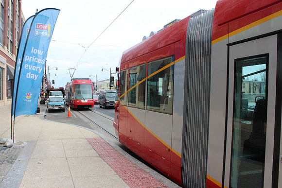 A streetcar passing the Giant grocery store on H Street