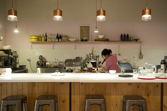 Owner Kera Carpenter prepares salad dressing at Nurish