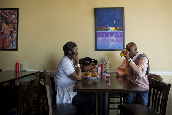 ANC 8A07 commissioner Natalie Williams, left, eats lunch with Darrick Strickland at the Uniontown Bar and Grill. She says she comes here a lot and is excited about the revitalization in this neighborhood