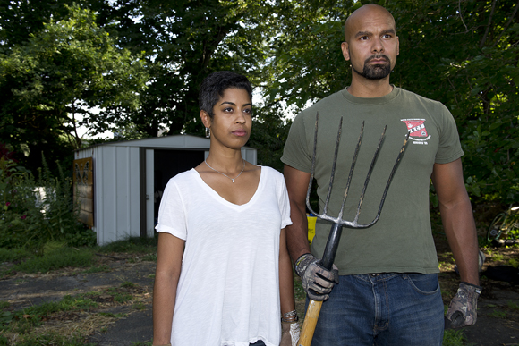Ryan Palmer, left, and AJ Cooper, of Freedom Farms, re-enact "American Gothic" at Gail Taylor's Fourth Street Garden