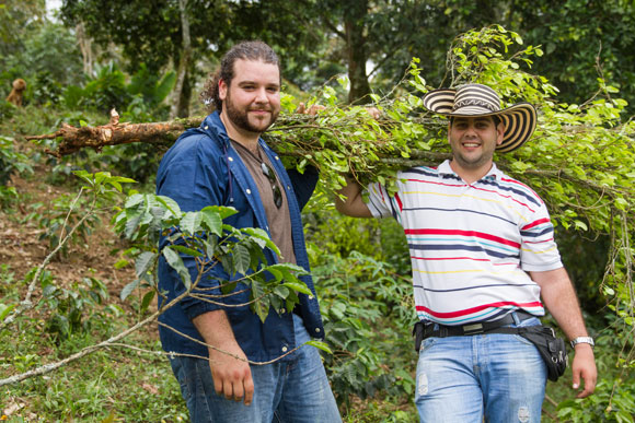 Santiago Moncada, left, founder of Redeeming Grounds, and his brother Juan Camilo, RG's on-the-ground rep in Colombia, holding a coca plant