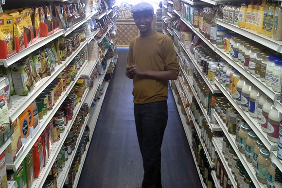 Owner George Ayele in the aisles of the new H St Organic Market