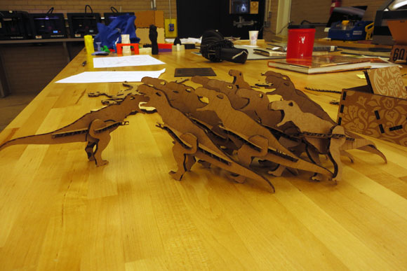 Rawr! These dinosaurs were cut out of cardboard with the library's laser cutter