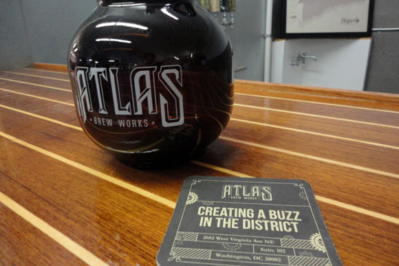 A Pella growler (2 liters) and a coaster