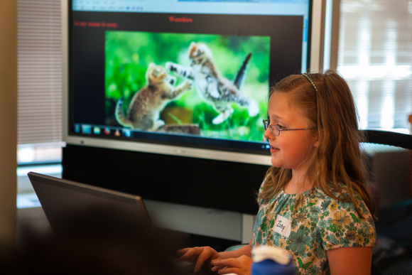 Two new organizations in D.C. are bridging the gender divide in tech. Here, Zoey, a Girls Rock On The Web (GROW) participant, shows off the website she built dedicated to her favorite books