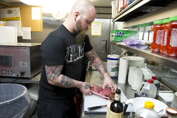 Eric Judycki, owner of JerkFace Artisanal Beef Jerky, uses kitchen space at Bourbon in Adams Morgan while the bar is closed to make a batch of garlic chili jerky