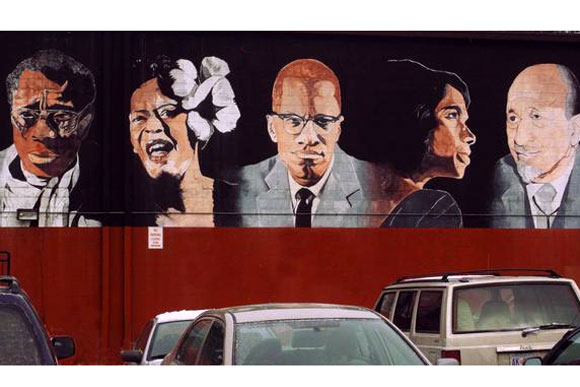 A mural of historic black Americans in a shopping center in Ward 7's future downtown