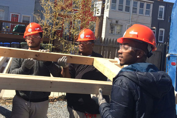 Students at the Cardozo Academy of Construction and Design work on the tiny house that is part of their spring project. While tiny houses are technically not legal as dwellings in the District, many see them as a crucial part of cities' future