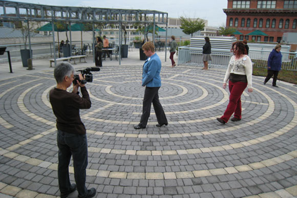 People walk the labyrinth on the green roof at one of the American Psychological Association's buildings. The labyrinth is rather unique, but green roofs and other green building techniques are increasingly common in D.C.