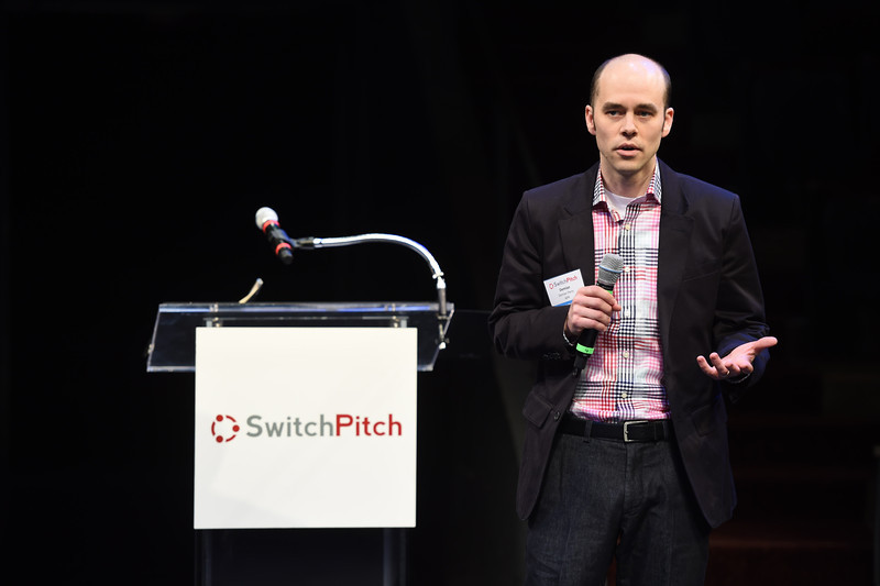 Demian Perry, director of mobile for NPR, pitches his project to a room full of startups at SwitchPitch